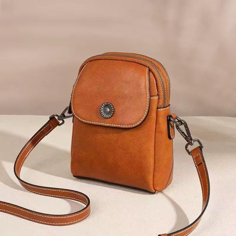 Damen Umhängetasche aus Oil-Wax-Leder in Schwarz, Braun, Karamell oder Weiß – urbane Schultertasche mit Clamshell-Verschluss und eleganter Nahtverzierung.