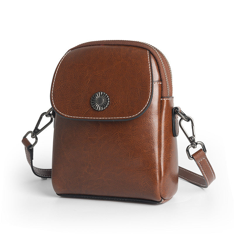 Damen Umhängetasche aus Oil-Wax-Leder in Schwarz, Braun, Karamell oder Weiß – urbane Schultertasche mit Clamshell-Verschluss und eleganter Nahtverzierung.